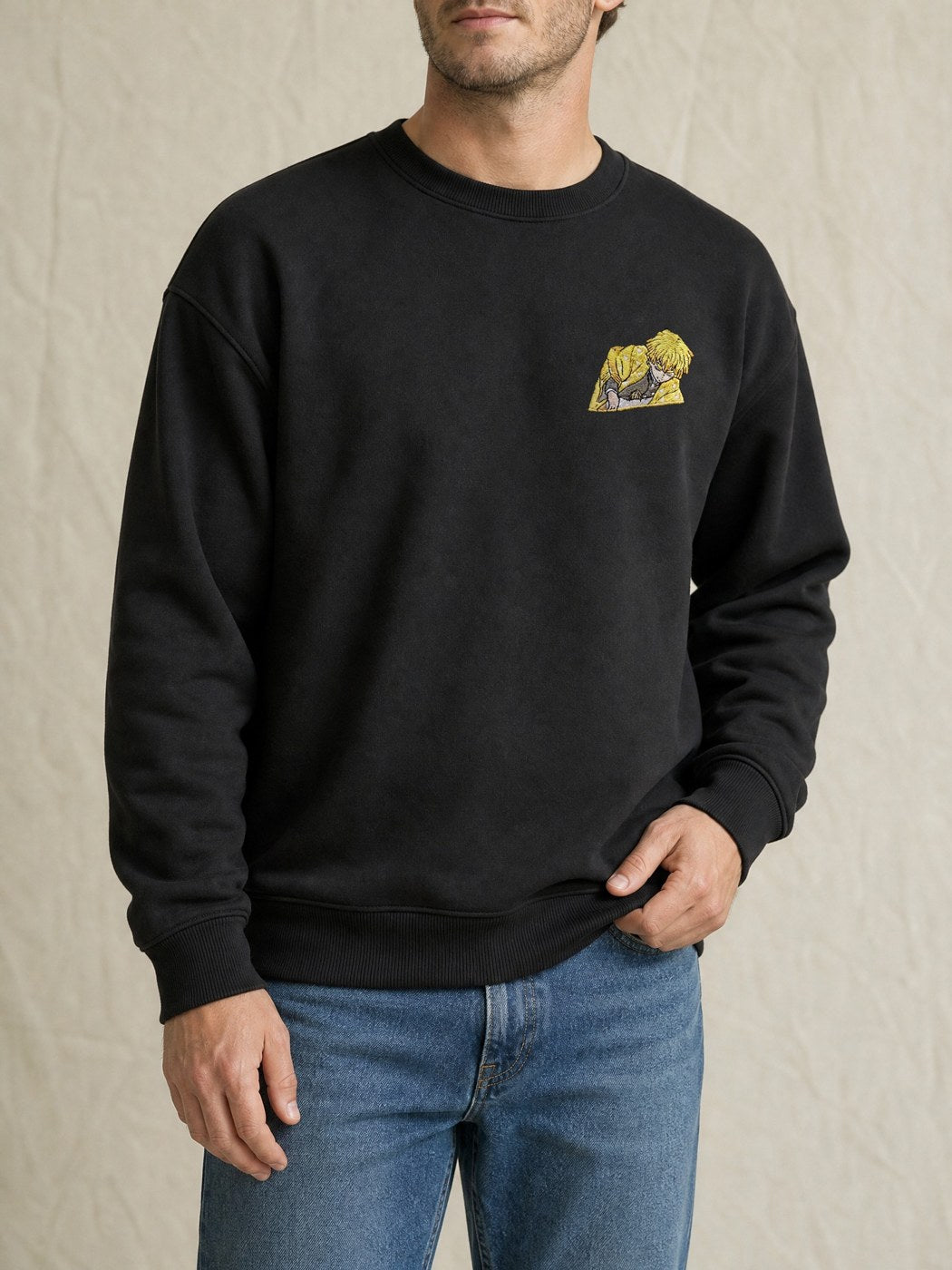 Broderie Zenitsu sur le pull noir, côté cœur