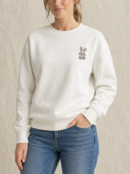 Broderie Lapin sur le pull blanc, côté cœur