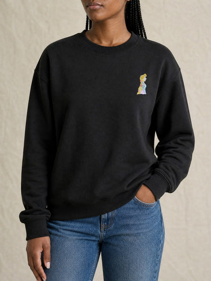 Broderie Raiponce sur le pull noir, côté cœur
