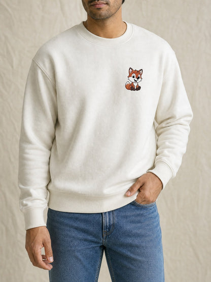 Broderie Renard sur le pull blanc, côté cœur