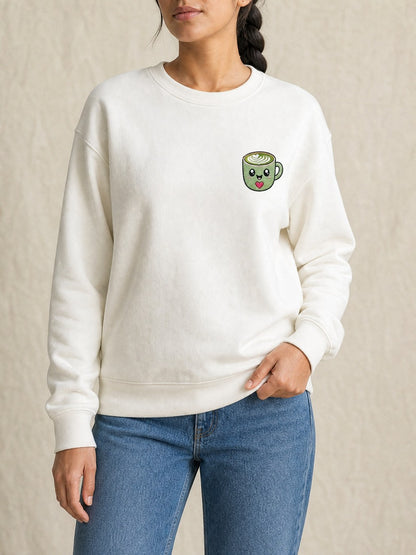 Broderie Team Matcha sur le pull blanc, côté cœur